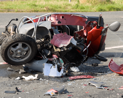 A motorcycle in pieces after an accident.